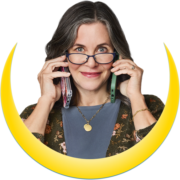 A woman holding two phones to her ears